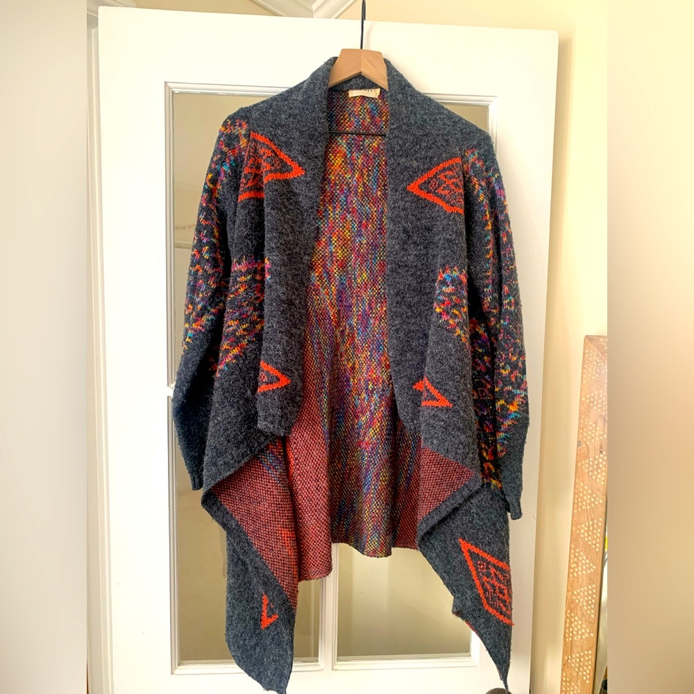 Large cozy sweater. Polyester, nylon, acrylic blend.